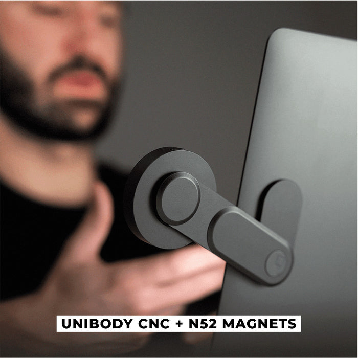 EDGE® Full Kit - Productivity magnetic kit - Carrara White - Matte black magnetic arm mount attached to the back of a silver laptop with circular magnet pads. - Rolling Square