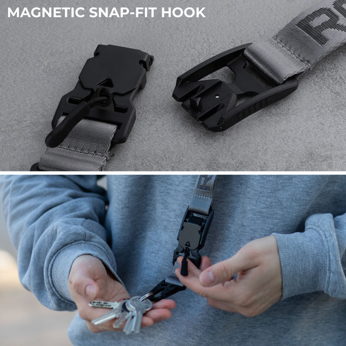 Rolling Square Lanyard - Digital ID & QR Lost Mode - Silver Fog - Charcoal black lanyard with magnetic snap-fit hook holding keys, worn with gray sweatshirt. - Rolling Square