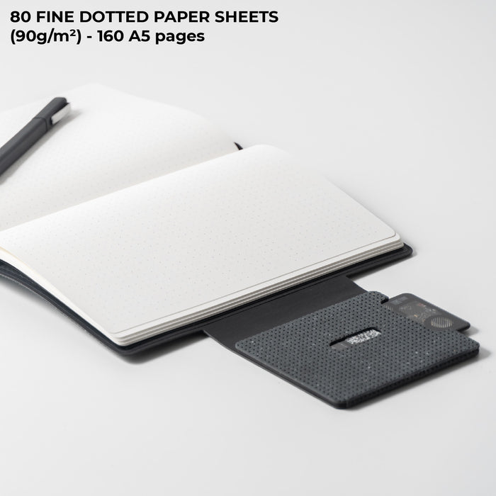 AirCard™ Notebook - A5 notebook made for AirCard - Grainy Black - A5 notebook with grainy black cover, open to blank dotted pages, paired with a slim black AirCard device. - Rolling Square